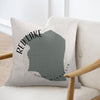 Pillow with Red Lake Minnesota outline and text on a chair.