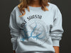 Light blue sweatshirt with Lake Shasta California compass design