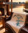Lake Greeson Arkansas map on a woven throw blanket on a couch.