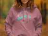 Pink hoodie with a circular design featuring "Buckeye Lake Ohio" and a compass.