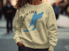 Cream sweatshirt with Snow Lake Washington design and compass graphic.