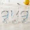 Three clear glasses with "Shuswap Lake" and a map design.