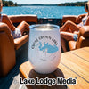 A white travel tumbler featuring a Choke Canyon Lake map design, sitting on a boat table.