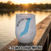 A white insulated wine tumbler featuring a blue outline of Redfish Lake, Idaho, resting on a wooden dock.