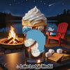 Glass of coffee topped with whipped cream beside s'mores ingredients.