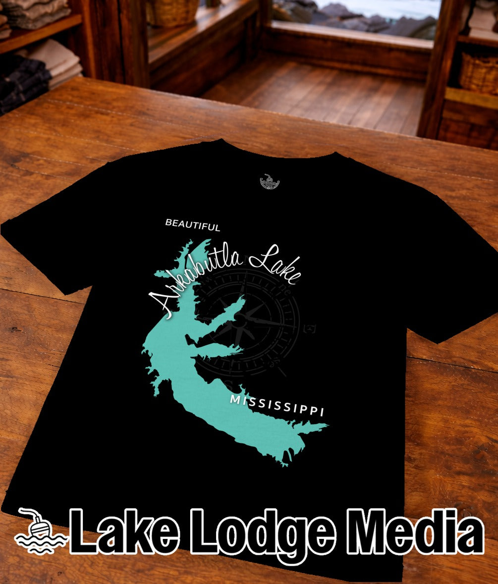 Black t-shirt with teal "Lake Ouachita Mississippi" graphic and compass rose.
