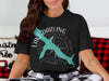 Black t-shirt with teal fish shape outline over compass and text Lake Darling Iowa.