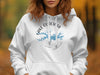 White hoodie featuring a blue compass design with "Lake Ouachita Arkansas" text.