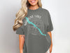 T-shirt with Maligne Lake Canada compass graphic and turquoise lake outline.