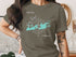 Gray t-shirt with "Key West" text and compass rose map graphic.