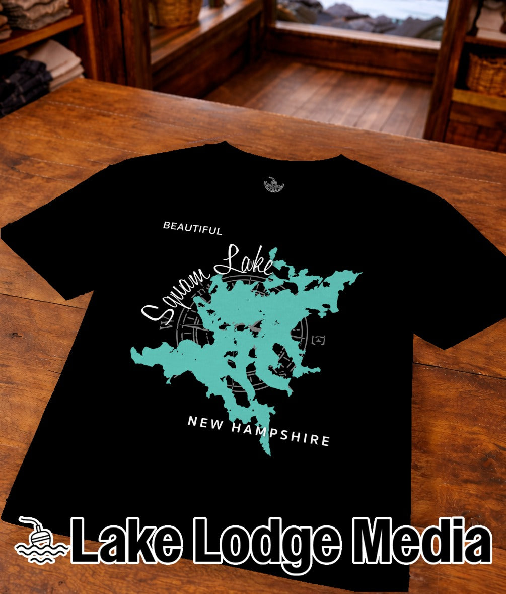Black t-shirt with teal map of Squam Lake, New Hampshire, and "Lake Lodge Media" logo.