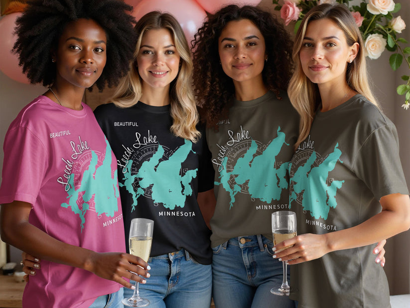 Four women in graphic t-shirts featuring a map of Leech Lake, Minnesota.