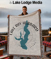 Man holds a woven blanket featuring a map of Lake Ray Hubbard, Texas.