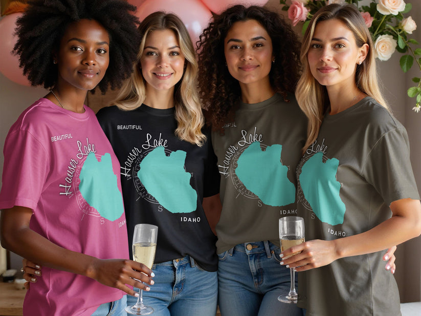 Four women in t-shirts with a map of Lake Hauser, Idaho graphic.