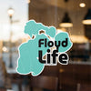 Turquoise sticker with black text reading "Floyd Life" on glass.