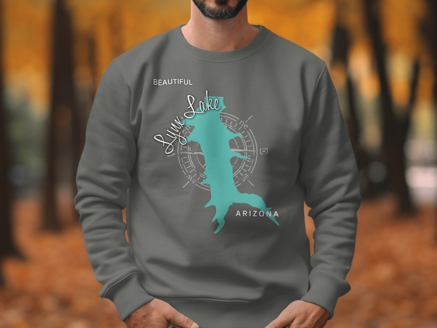 Grey sweatshirt with turquoise Lynx Lake, Arizona map graphic and compass rose.
