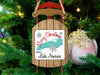 Sled ornament with "Merry Christmas From Lake America" text, snowflakes, and lake graphic.