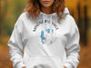 White hoodie with "Minong Flowage Wisconsin" map and compass design.