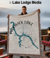 Man holding a woven throw blanket with a map of Pickwick Lake, Mississippi.