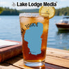 Glass with Lake Tahoe outline and text, garnished with lemon slice.