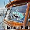 Turquoise Skiatook Lake outline sticker with "Skiatook Life" text on boat window.