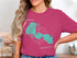 Turquoise map of Forest Lake, Minnesota on a magenta t-shirt.