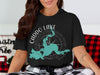 Black t-shirt with Caddo Lake map graphic and Texas text.