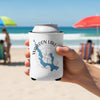 White can cooler with "Walloon Lake Michigan" and compass design, held on a beach.