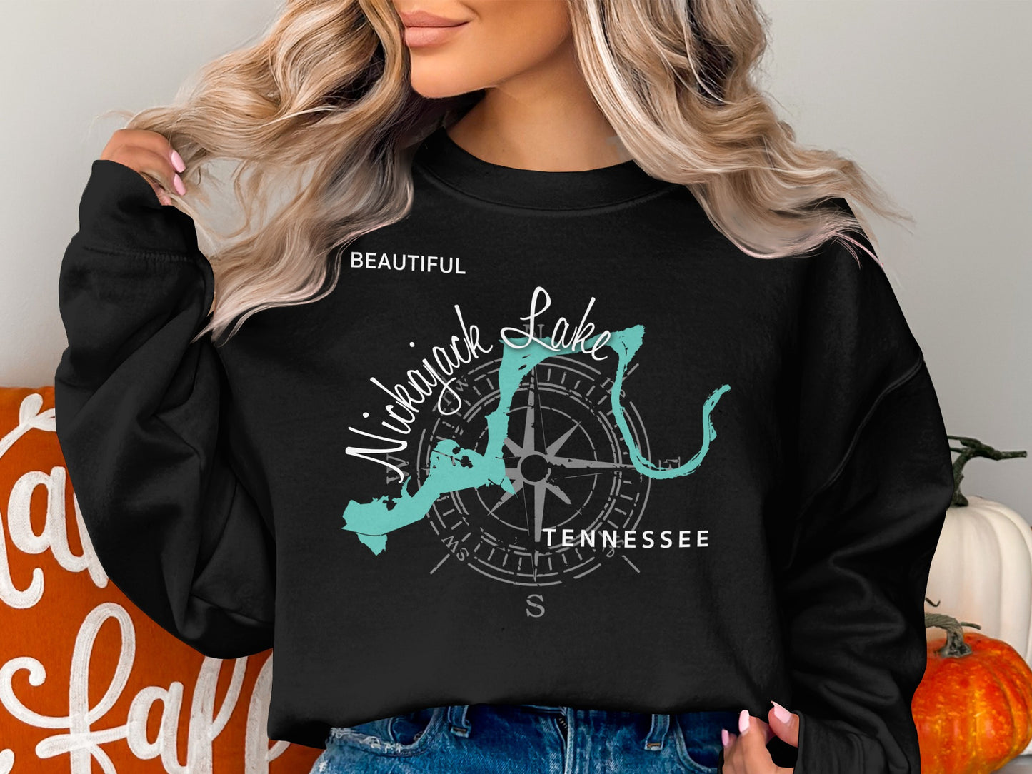 Black sweatshirt with "Beautiful Nickajack Lake Tennessee" and compass graphic.