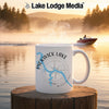 White mug with Pickwick Lake Mississippi map and compass on a serene lake background.
