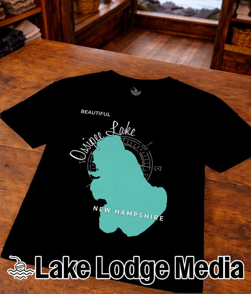 Black t-shirt featuring a teal outline of New Hampshire with "Quinebaug Lake" and "New Hampshire" text.