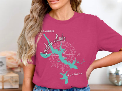 Pink t-shirt with a teal Jordan Lake map and compass graphic, reading "Beautiful Jordan Lake Alabama".