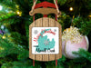Sled ornament with "Merry Christmas from Merrill Creek" text and Michigan shape.