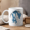 White mug with blue Lake Massabesic map and compass design, New Hampshire.