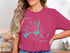 Lake Mead compass rose graphic on a magenta t-shirt.