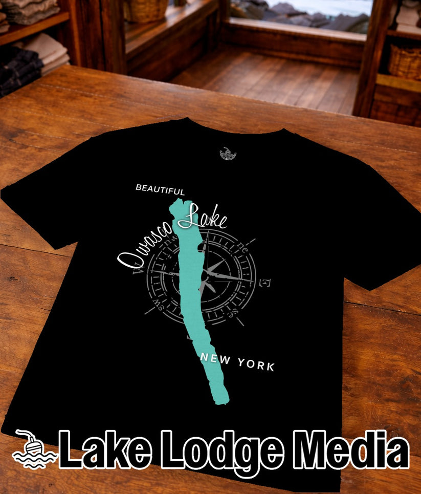 Black t-shirt with a stylized map of Owasco Lake and compass rose.
