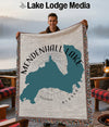 Man holding woven blanket with Mendenhall Lake shape and Alaska text.