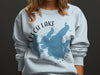 White sweatshirt with a blue Leech Lake, Minnesota map and compass graphic.
