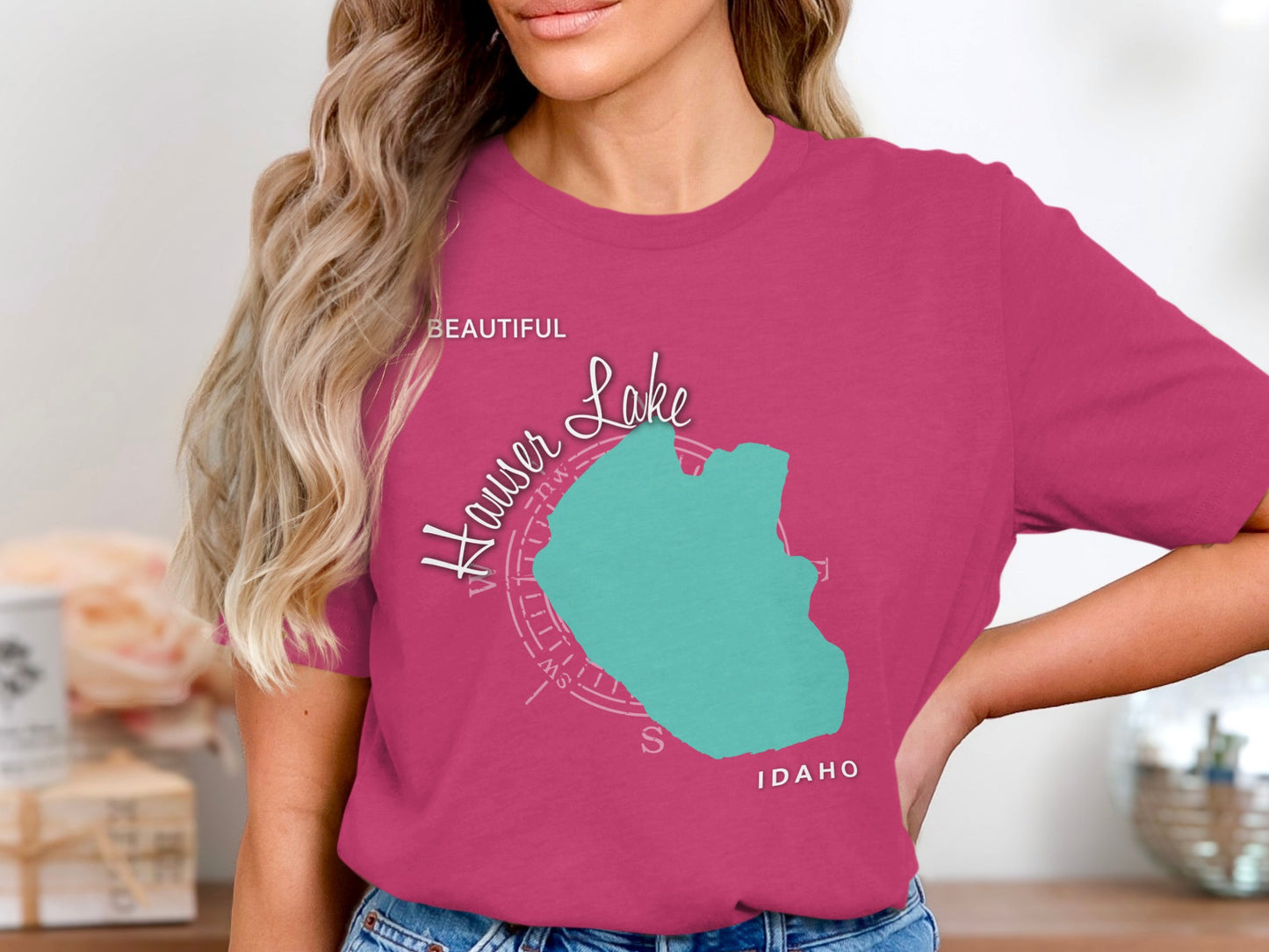 Pink t-shirt with turquoise silhouette of Hauser Lake, Idaho.