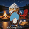 Glass with swirl of whipped cream, layered drink, s'mores ingredients, campfire, and lake at night.