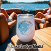 White stemless wine tumbler with a Big Sandy Lake, Minnesota graphic on a boat table.