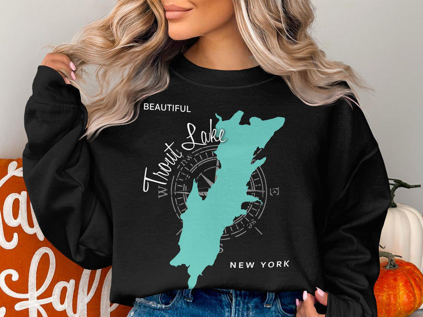 Black sweatshirt with a teal map of Trout Lake, New York, and compass rose graphic.