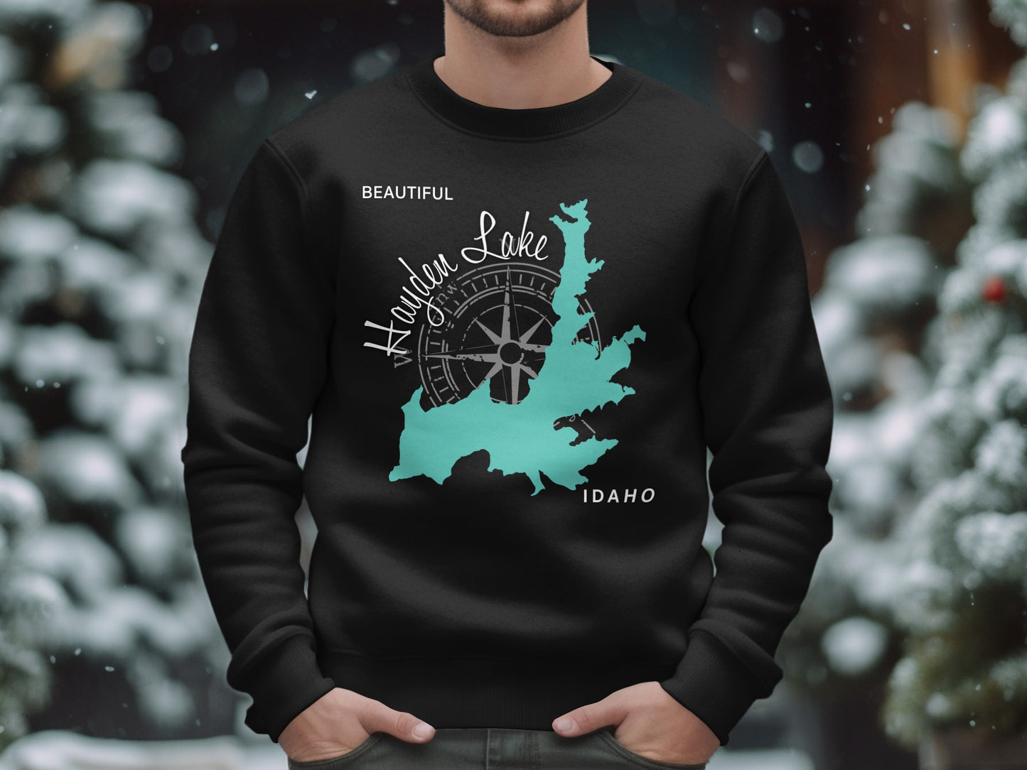 Black sweatshirt with a teal map of Hayden Lake, Idaho, and compass rose.