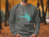 Gray sweatshirt with "Beautiful Lake Rampart Colorado" map design and compass.
