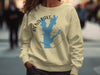 Light yellow sweatshirt with Rend Lake outline map and compass graphic.