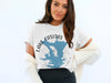 White t-shirt with a blue map graphic and text "LAKE CASITAS CALIFORNIA".