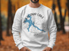 White sweatshirt featuring Pokegama Lake, Minnesota graphic with compass rose.