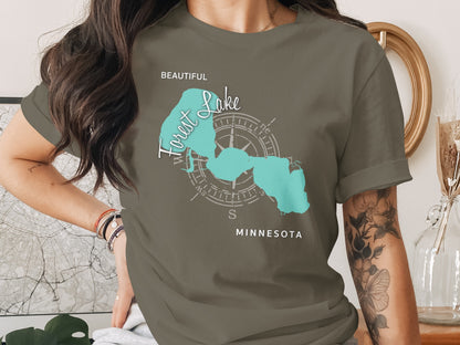Turquoise Forest Lake map graphic on a dark olive t-shirt.