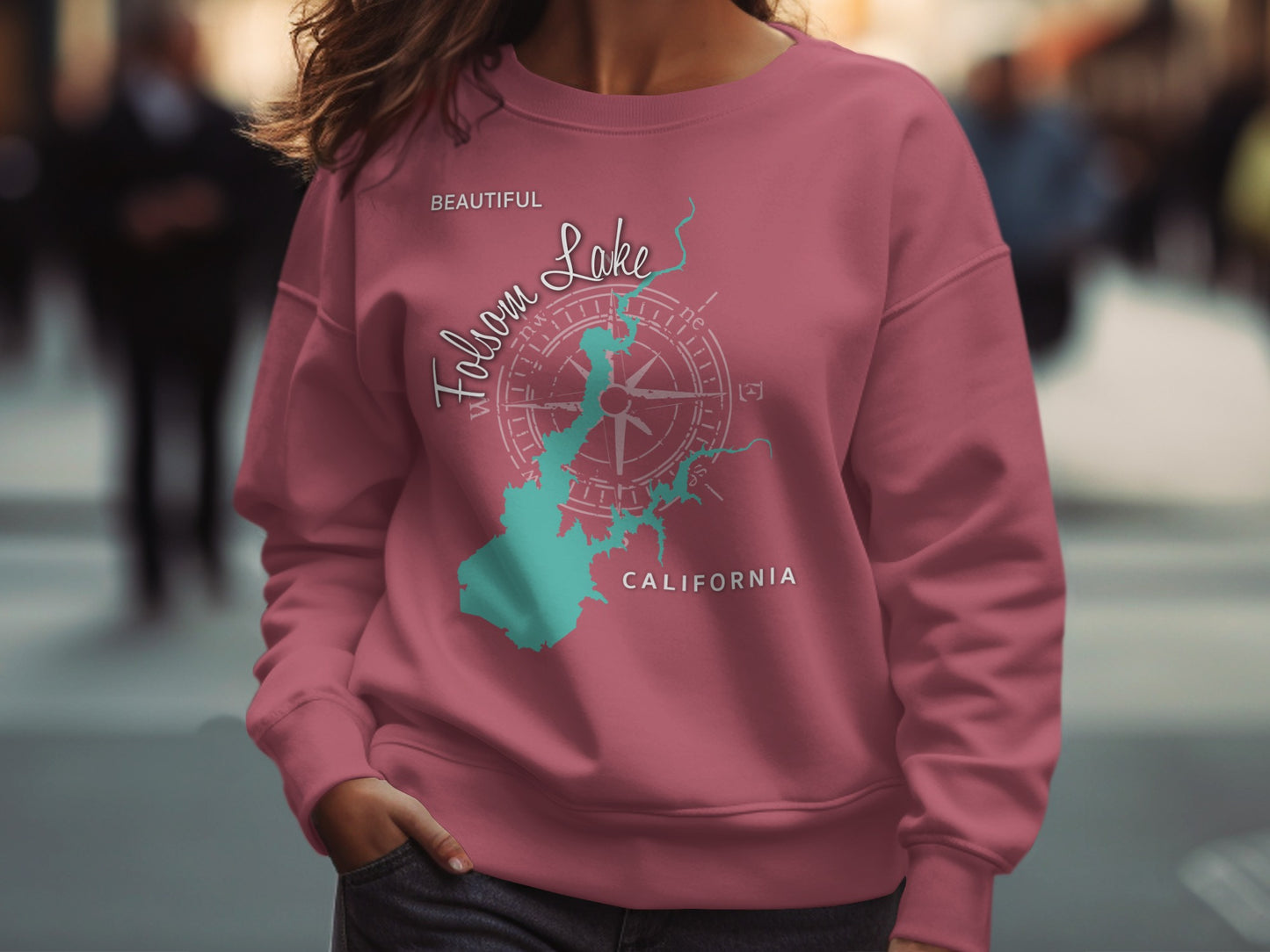 Pink sweatshirt with Folsom Lake map and compass graphic.