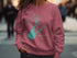 Pink sweatshirt with Folsom Lake map and compass graphic.